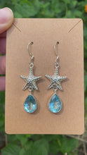 Load and play video in Gallery viewer, Sterling Silver Blue Topaz With Starfish Earrings
